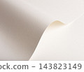 White paper texture, curled sheet off with curve and fold. Beige cream wave shape, bent edge in close up with fine grain and shadow. Matte designer paper, elegant pastel backdrop. 143823149