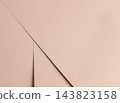 Peach beige paper texture, folded sheet with diagonal fold line and crease. Pastel surface close up, matte edge shape with shadow and curve. Designer paper backdrop, minimal neutral 143823158