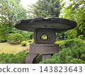 A stone lantern that looks like both a heart and a spade. 143823643