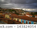 Zipaquira Colombia a Stormy Sky Over Colombian Hillside Town with Red Tile Roofs 143824054
