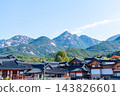 Traditional Korean Hanok Houses and Tiled Roofs against Bukhansan Mountain in Eunpyeong Hanok Village, Seoul 143826601