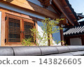 Traditional Korean Hanok Houses and Tiled Roofs against Bukhansan Mountain in Eunpyeong Hanok Village, Seoul 143826605