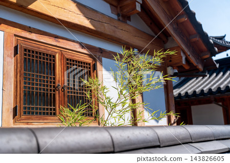 Traditional Korean Hanok Houses and Tiled Roofs against Bukhansan Mountain in Eunpyeong Hanok Village, Seoul Traditional Korean Hanok Houses and Tiled Roofs against Bukhansan Mountain in Eunpyeong Hanok Village, Seoul 143826605