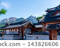 Traditional Korean Hanok Houses and Tiled Roofs against Bukhansan Mountain in Eunpyeong Hanok Village, Seoul 143826606