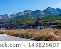 Traditional Korean Hanok Houses and Tiled Roofs against Bukhansan Mountain in Eunpyeong Hanok Village, Seoul 143826607