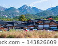Traditional Korean Hanok Houses and Tiled Roofs against Bukhansan Mountain in Eunpyeong Hanok Village, Seoul 143826609