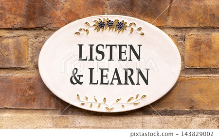 Listen and learn words symbol. Concept words Listen and learn on beautiful white sign plate. Beautiful brown brick wall background. Business listen and learn support concept. Copy space. Listen and learn words symbol. Concept words Listen and learn on beautiful white sign plate. Beautiful brown brick wall background. Business listen and learn support concept. Copy space. 143829002