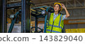Woman worker at forklift driver happy working in industry factory logistic ship. 143829040