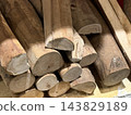 Stack of Cut Firewood Logs with Natural Wood Texture 143829189