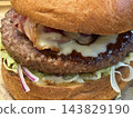 Juicy Beef Burger with Melted Cheese and Fresh Vegetables 143829190