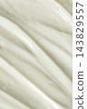 Abstract texture of fresh sour cream with smooth diagonal brush strokes 143829557
