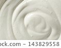 Abstract swirl texture of thick fresh sour cream. 143829558