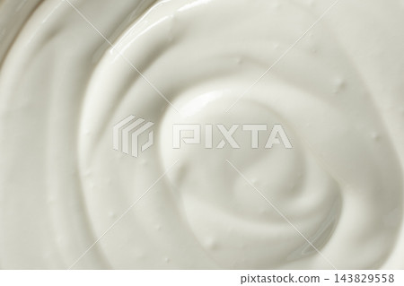 Abstract swirl texture of thick fresh sour cream. Abstract swirl texture of thick fresh sour cream. 143829558