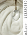 Culinary sour cream milky background. Spoon full of sour cream. Space for text. 143829559