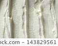 Abstract texture of smooth whipped cottage cheese 143829561