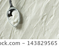 Creamy Cottage Cheese Texture Background with Spoon 143829565