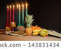 Kwanzaa kinara candles with harvest festival symbols 143831434