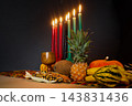 Kwanzaa kinara and harvest offerings celebrating african heritage 143831436