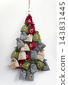 Handmade advent calendar forming a hanging christmas tree 143831445