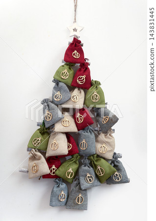 Handmade advent calendar forming a hanging christmas tree 143831445