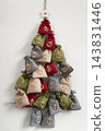 Numbered fabric advent calendar forming a hanging christmas tree 143831446