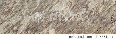 Layered stone surface with rugged geological texture 143831704
