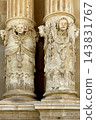 Baroque columns with cherub sculptures and religious carvings 143831767