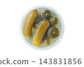 Fermented food. Pickled cucumbers in a plastic container, isolated on a white background. Preserved vegetables and healthy eating. Top view. 143831856