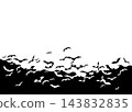 A flock of black bats flies across a plain white background at night 143832835