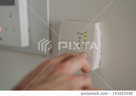 Turning on the heating in a European apartment at the start of the heating season Turning on the heating in a European apartment at the start of the heating season 143833590