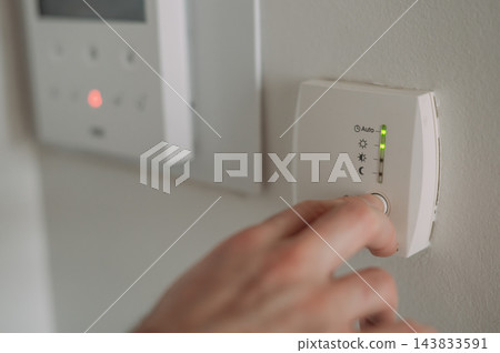 Turning on home heating at the start of the heating season with copy space Turning on home heating at the start of the heating season with copy space 143833591
