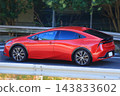 Red Japanese-made hybrid car 143833602