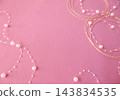 Pink background with gold mizuhiki and pearl chain decorations 143834535