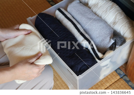 A scene of changing clothes and organizing winter clothing. A scene of changing clothes and organizing winter clothing. 143836645