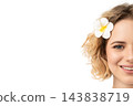 Young woman smiles, flower in hair, isolated on white, PNG 143838719