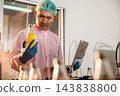 Expert inspector ensures top standards on the beverage production line 143838800