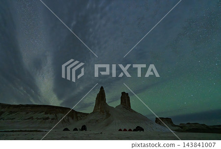 A starry sky and thin clouds stretching over the tusk-shaped rocks of Bozzilla. A starry sky and thin clouds stretching over the tusk-shaped rocks of Bozzilla. 143841007