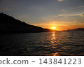 Wide open Adriatic Sea at golden sunset with silhouette rocky coast and sun reflection 143841223