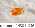 Dirty tomato sauce stain removal or ketchup on cloth accident to wash with washing powder, cleaning housework. 143841546