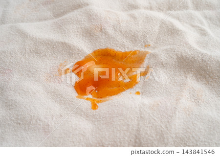 Dirty tomato sauce stain removal or ketchup on cloth accident to wash with washing powder, cleaning housework. 143841546