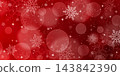 A Christmas red background with bokeh and snowflakes. 143842390