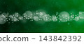 A Christmas green background with bokeh and snowflakes. 143842392