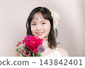 [Pink background] A young Japanese woman in her 20s in a wedding dress, looking at the camera, bride, wedding, bridal 143842401