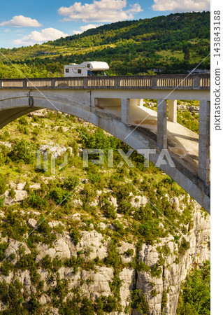 Caravan visiting Verdon Gorge in French Alps with Chauliere Bridge over the Artuby river, France. 143843188