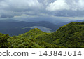 A mountain covered with clouds 143843614