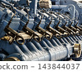 Industrial diesel engine fuel injectors arranged along the engine block in a factory 143844037