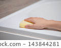 Image of cleaning a bathtub with a sponge (blurred focus) 143844281
