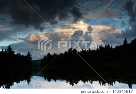 reflection of clouds in the lake 143845617