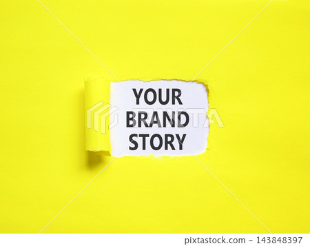 Branding and your brand story symbol. Concept words Your brand story on beautiful white paper. Beautiful yellow paper background. Business branding your brand story concept. Copy space. 143848397