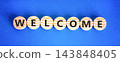 Welcome word symbol. Concept word Welcome on beautiful wooden circles. Beautiful blue background. Business welcome word concept. Copy space. 143848405
